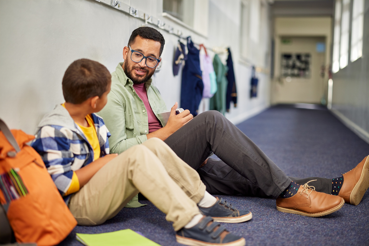 Male teacher with student