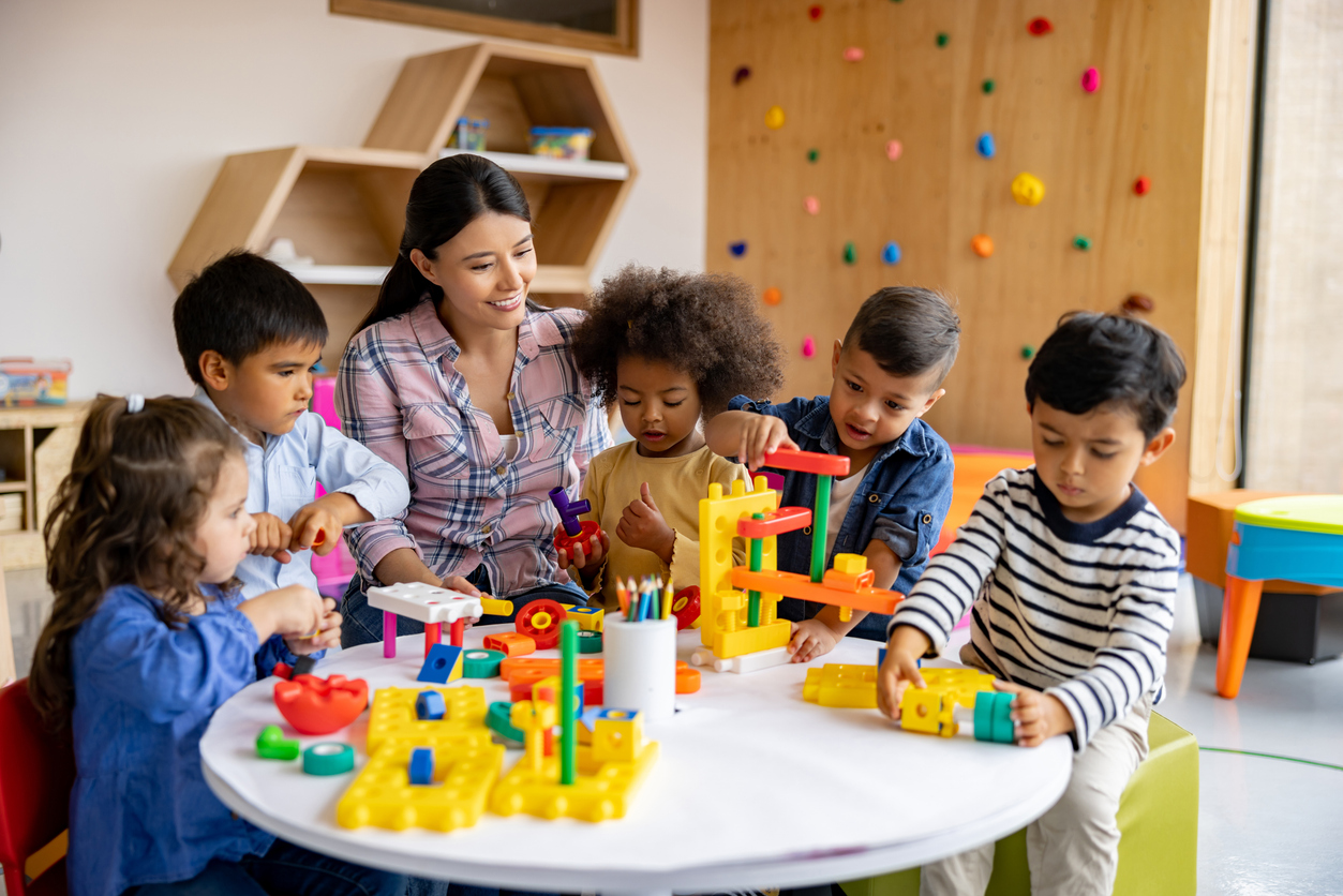 early childhood education teacher with students