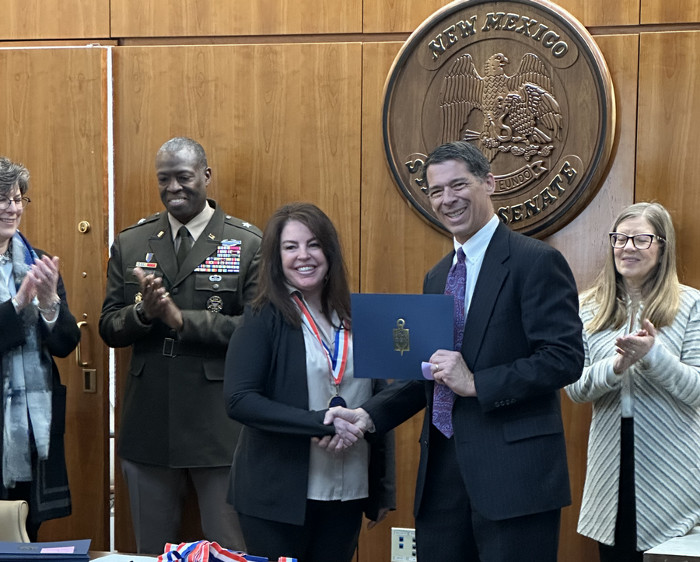 President receiving an award for a student 